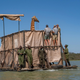 The barge includes tall fencing to keep Asiwa from falling over. Asiwa was sedated and had a hood placed on her to keep her calm during the mile-long journey across the lake.